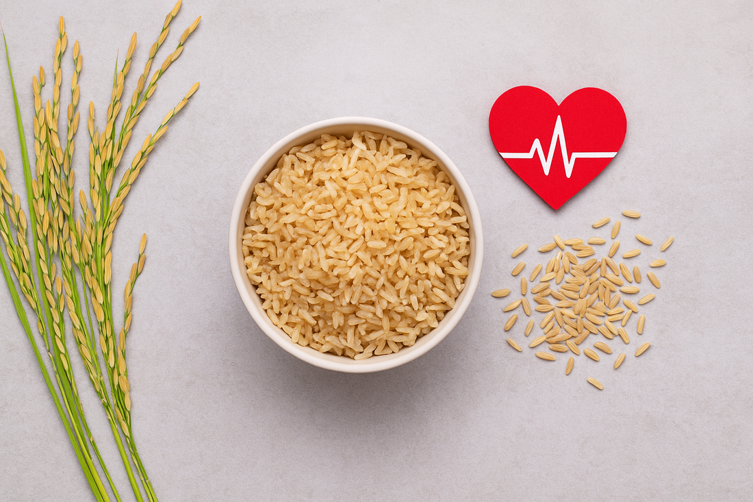 Bowl of cooked brown rice beside rice stalks